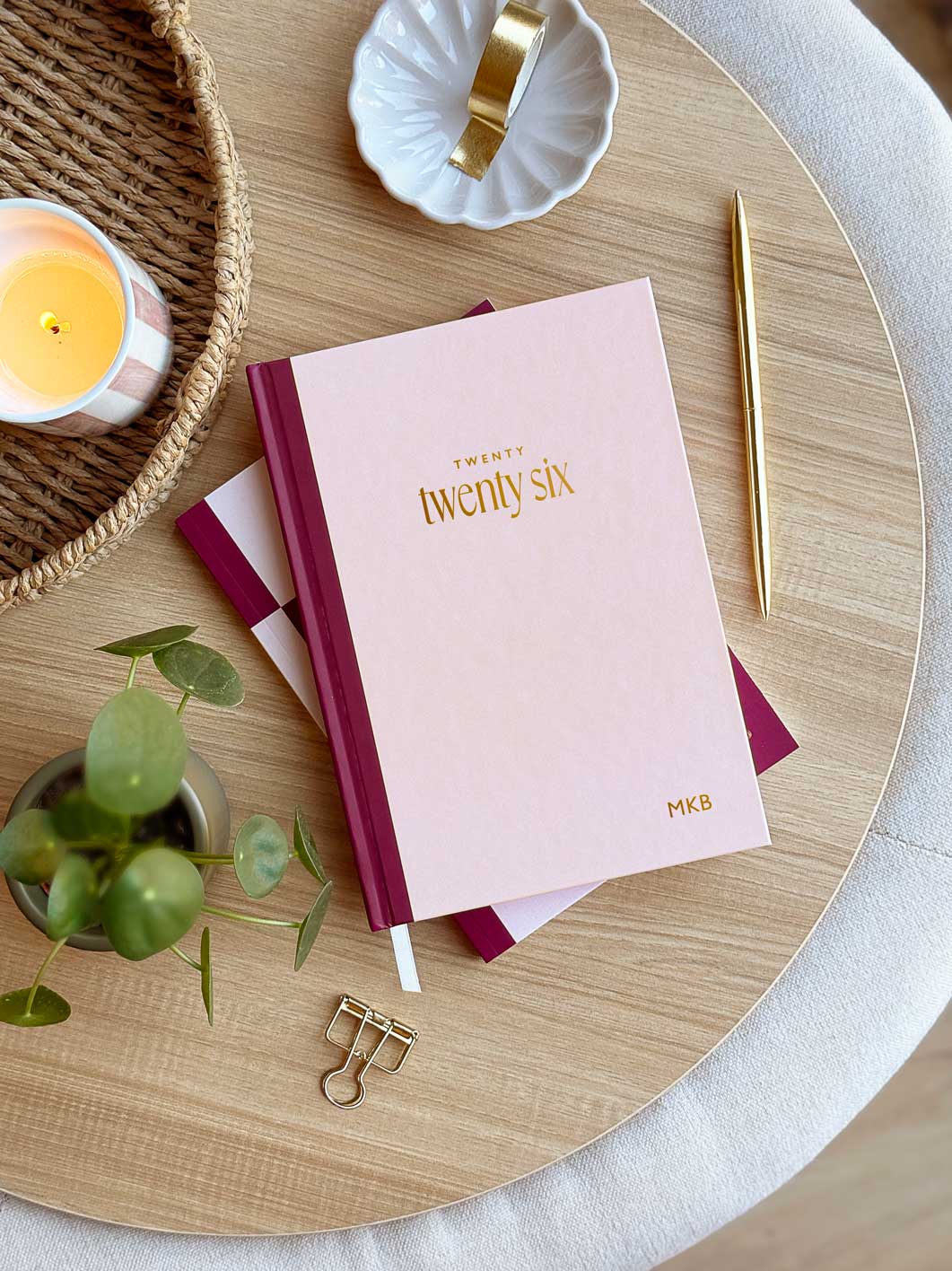 pink A5 hardback weekly diary with gold foiled "2026" lettering and personalised initials embossed in the corner of the planner cover