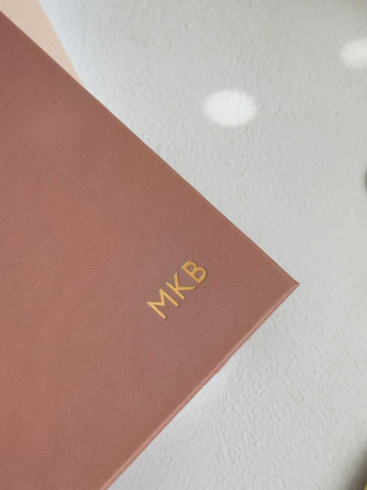 terracotta 2026 hardback diary with initials 'MKB' embossed in gold foil on the planner cover