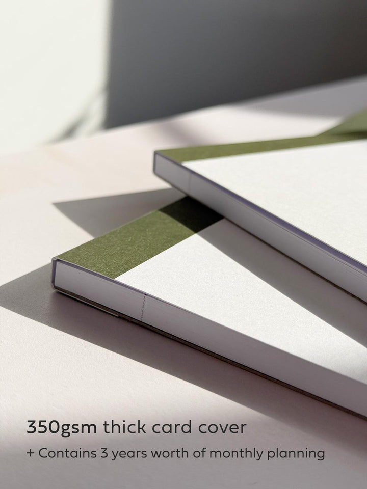 close up of notepad with cover by aim studio co