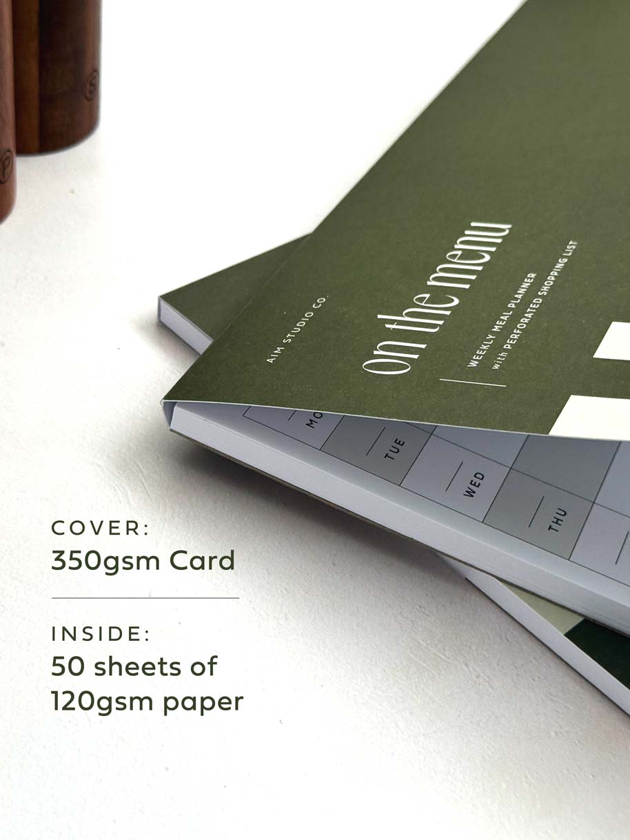 close up of notepad with cover showing paper thickness details.