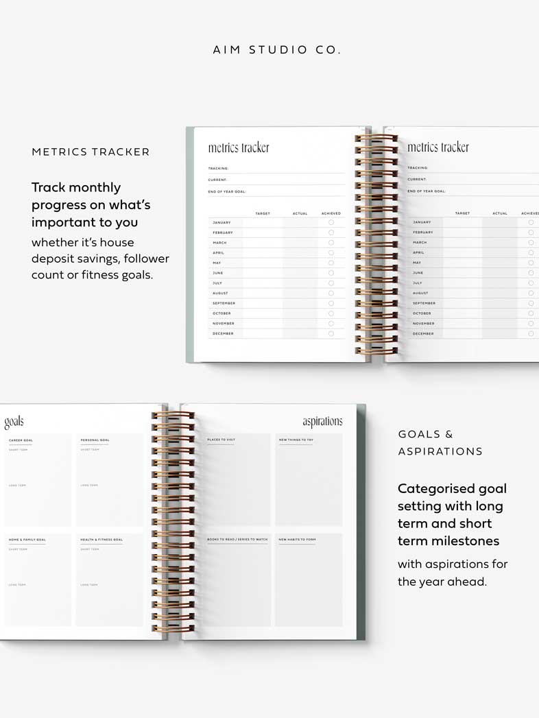 Spiral-bound 2026 diary with open pages showing 'Metrics Tracker' and 'goal setting pages, by AIM Studio Co.
