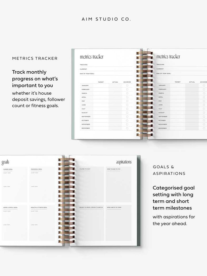 Spiral-bound 2026 diary with open pages showing 'Metrics Tracker' and 'goal setting pages, by AIM Studio Co.