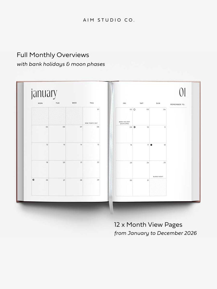 Open page of 2026 weekly planner showing showing monthly calendar overview with bank holidays and moon phases designed by 'AIM Studio Co.'