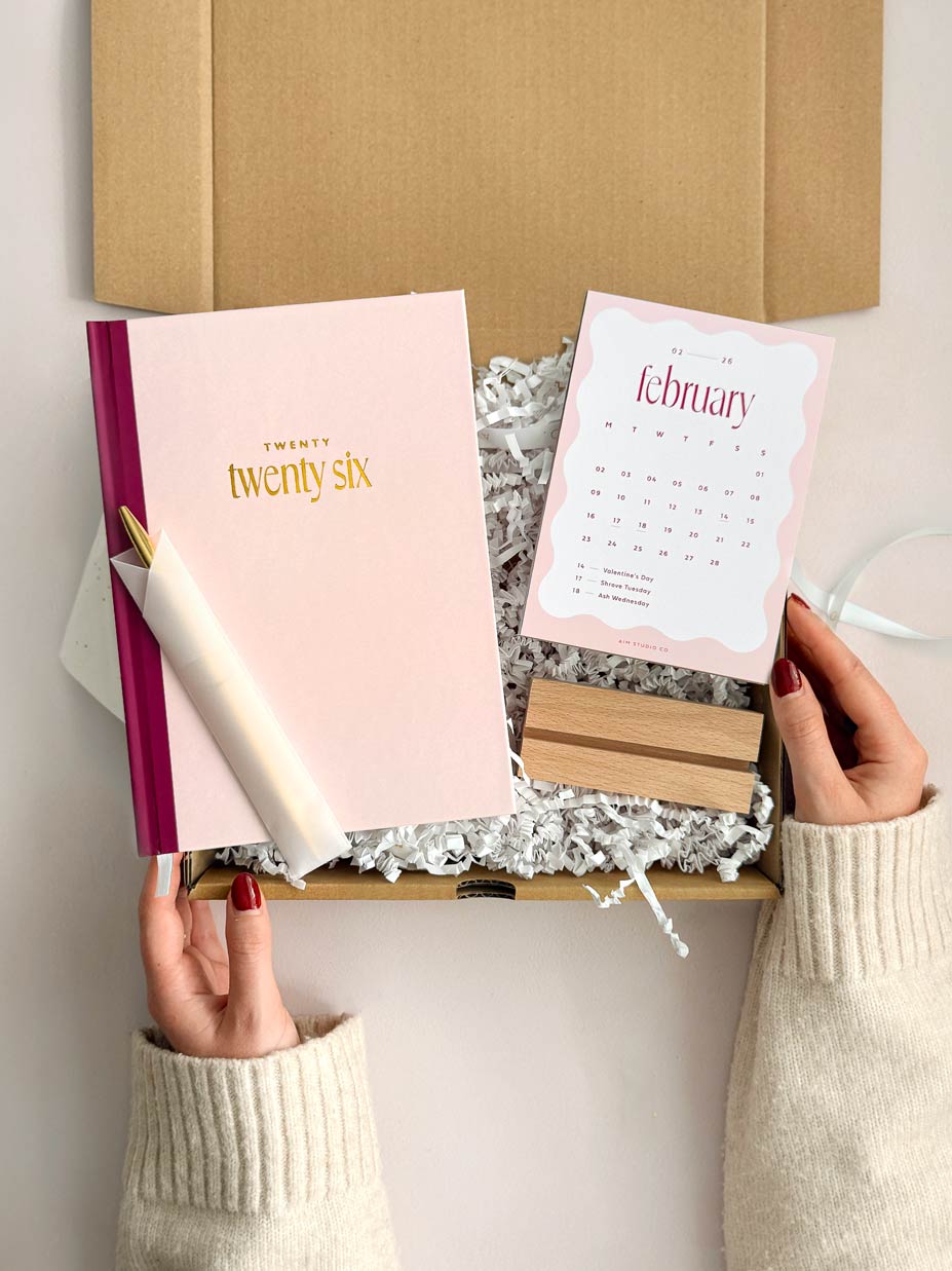 2026 planner bundle with pink hardback diary and 2026 monthly desk calendar with wooden holder