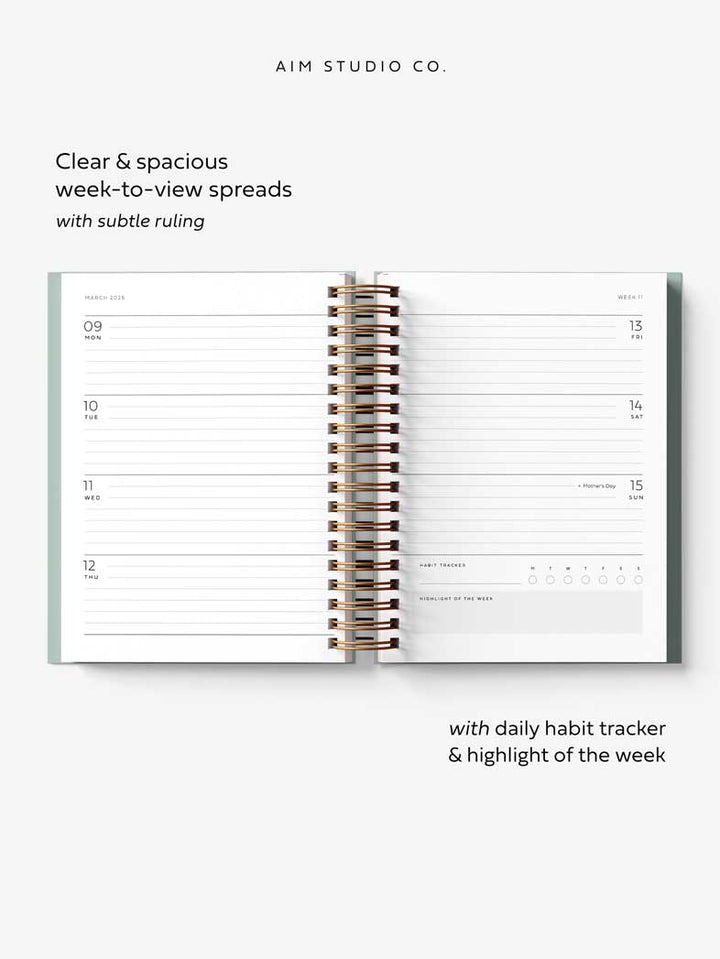 Open A5 planner showing weekly layout with UK bank holidays, daily habit tracker and highlight of the week feature.
