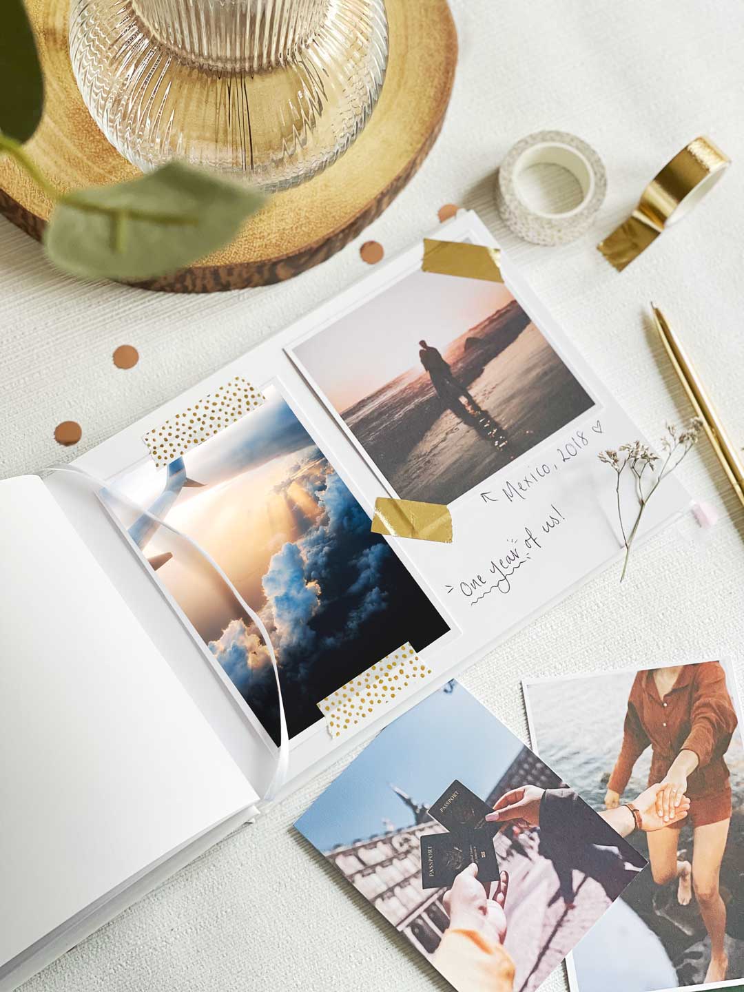 Inside scrapbook layout page showing travel photographs and handwritten captions explaining date and destination