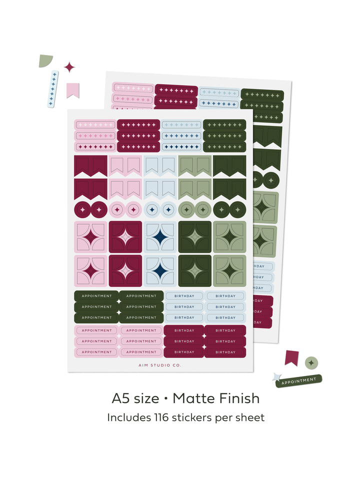 Two sheets of planner stickers in pink, burgundy, sage green, and pale baby blue, displayed on a white background with text that reads &