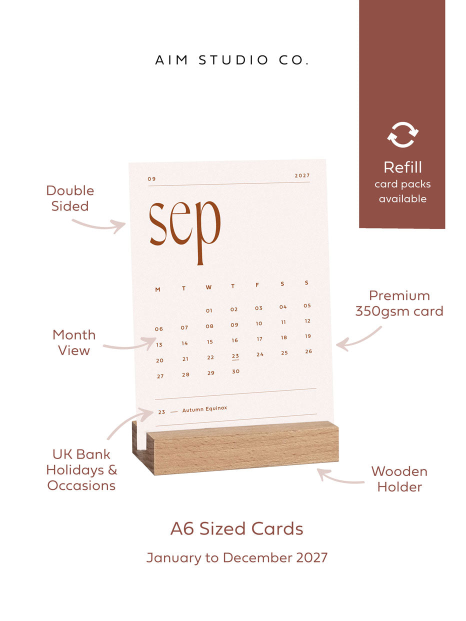 A6 sized desk calendar by aim studio co with product call-outs reading double sided print, premium 350gsm card, month view, wooden holder and UK bank holidays. A banner reads "refill card packs available"