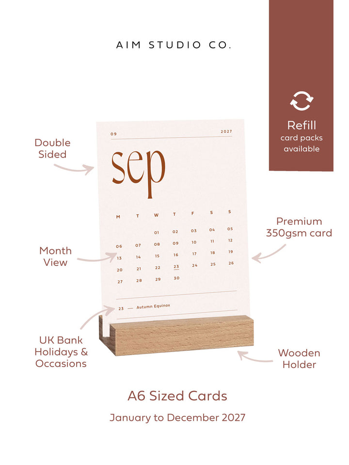 A6 sized desk calendar by aim studio co with product call-outs reading double sided print, premium 350gsm card, month view, wooden holder and UK bank holidays. A banner reads "refill card packs available"