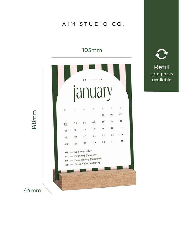 2027 desk calendar with wooden holder by aim studio co showing A6 size dimensions of the refillable striped monthly cards.