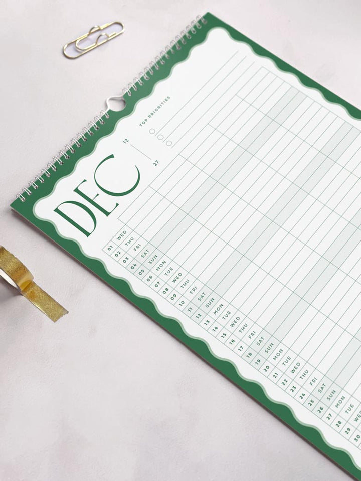 deep green and sage green wavy calendar design showing december 2027 page of the large a3 family calendar by aim studio co. The calendar page shows a vertical planner grid with 5 columns to add each family member&