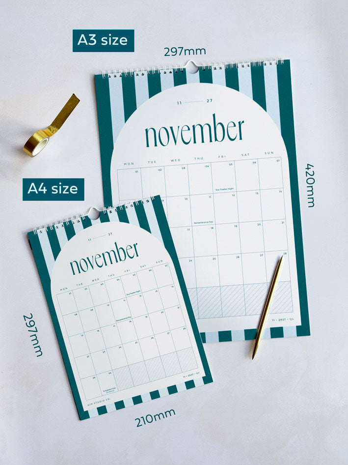 Two spiral-bound monthly wall calendars shown in A3 and A4 sizes on a light background, with teal and pale blue striped borders and a white arch with &