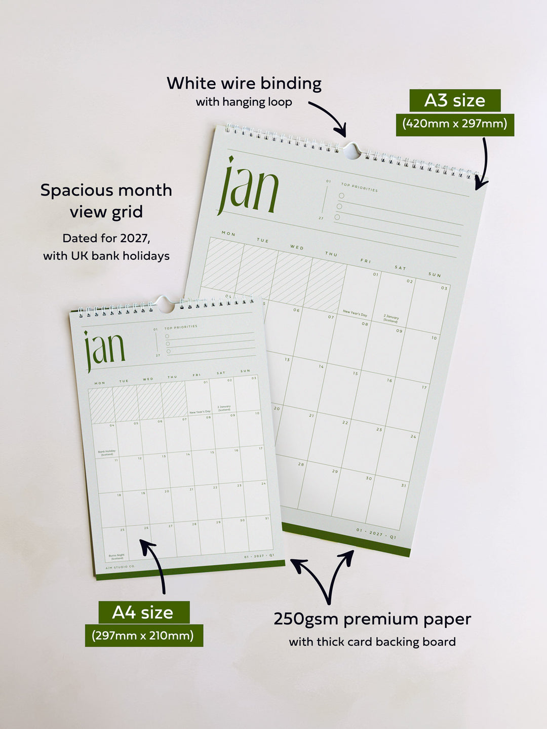 Two hanging A3 and A4 monthly view calendars on a light background with callout text explaining white wire binding, spacious month grid, dated for 2027, UK bank holidays, A3 and A4 sizes, and 250gsm premium paper with thick card backing.