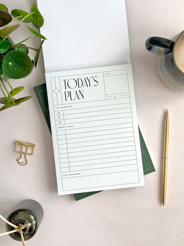 A daily planner notepad with &