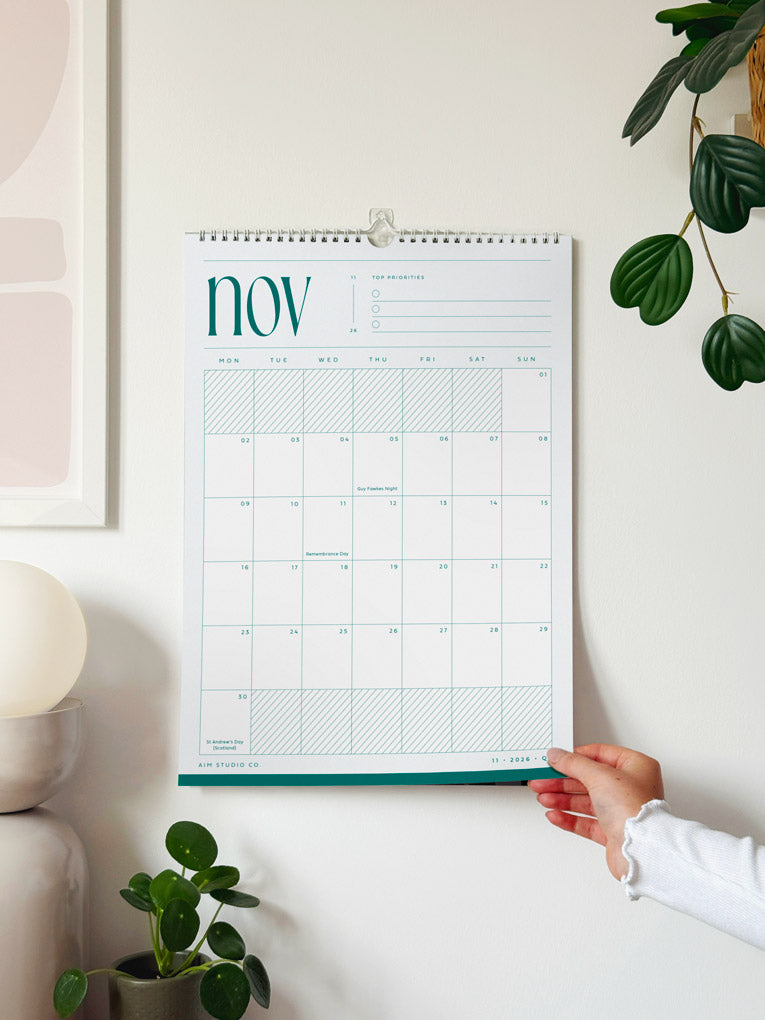 2027 calendar with minimalist design showing the month of november 2027 in pale blue and teal colours.