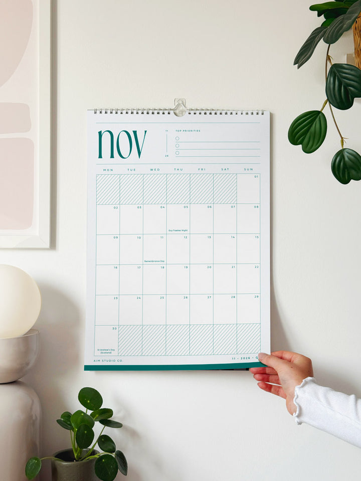 2027 calendar with minimalist design showing the month of november 2027 in pale blue and teal colours.