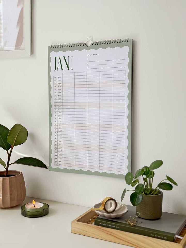 large hanging a3 calendar with month view of January 2026 family planner page with 5 column grid and old typography