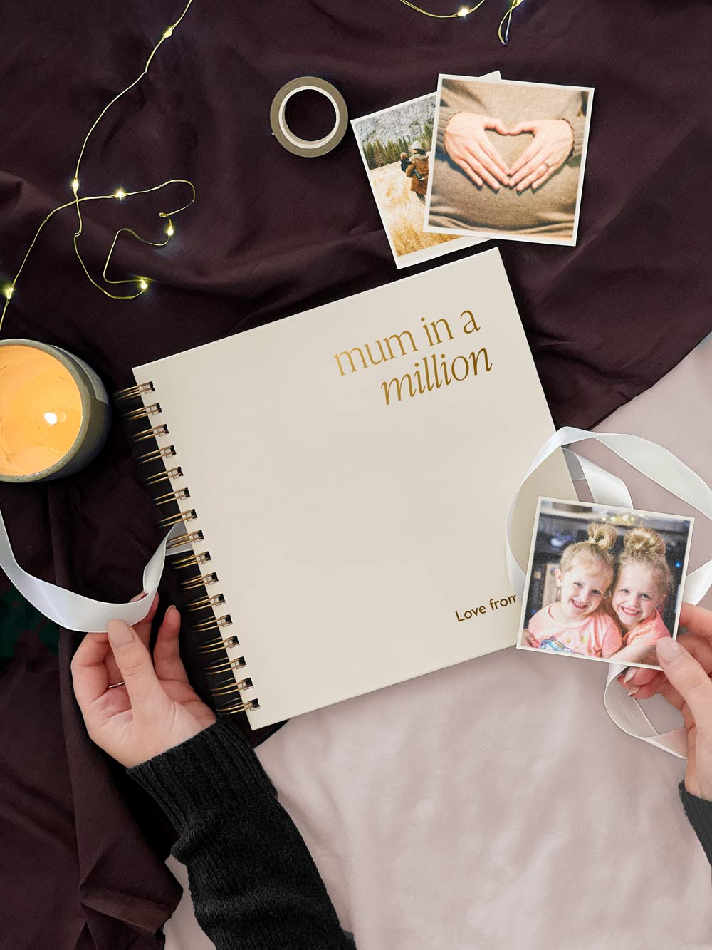personalised scrapbook reading mum in a million in gold foil surrounded by pictures of mum and daughters on mothers day