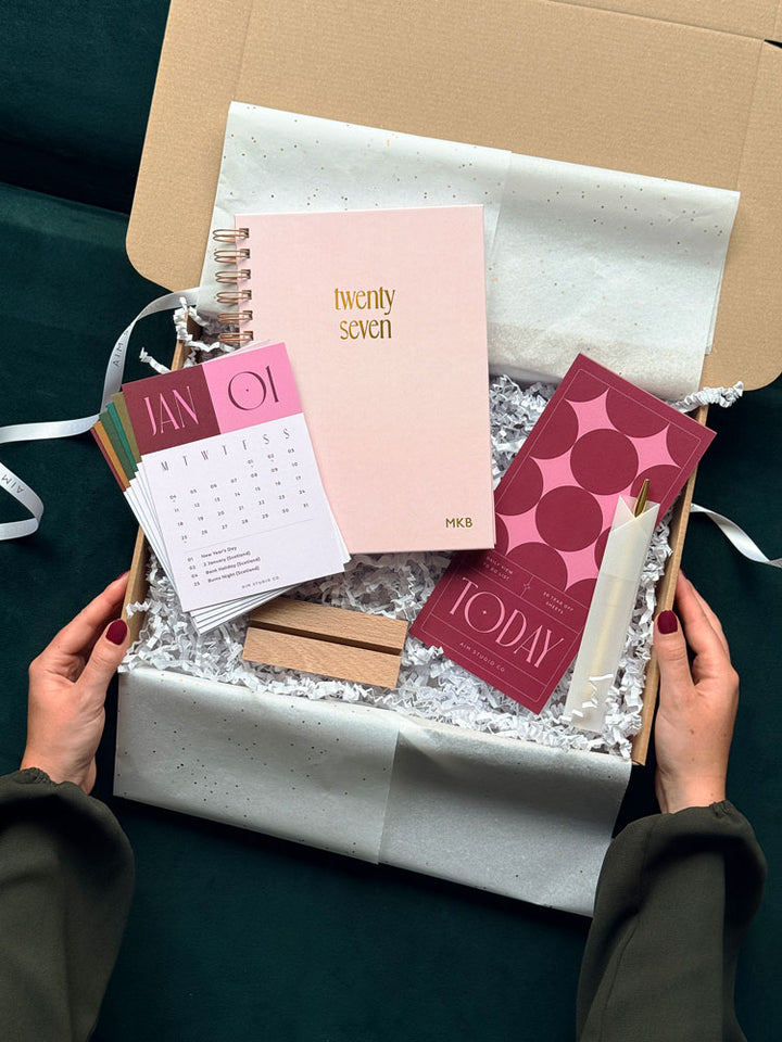 a personalised stationery gift bundle with pink and burgundy desk accessories for women. It&