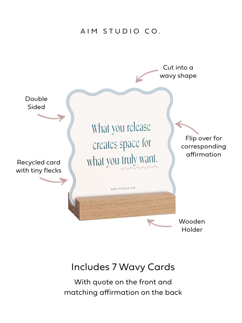 positive daily affirmation cards are held in a wooden stand with call out text with arrows highlighting the double sided print, wavy-shaped cards, recycled card with flecks, wooden holder and matching affirmation on the back of the inspirational quote card.